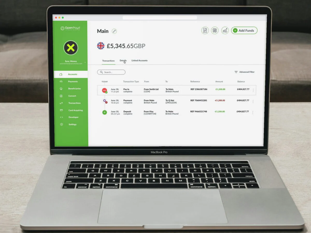 OpenPayd client dashboard on a laptop: GBP account balance and recent transactions